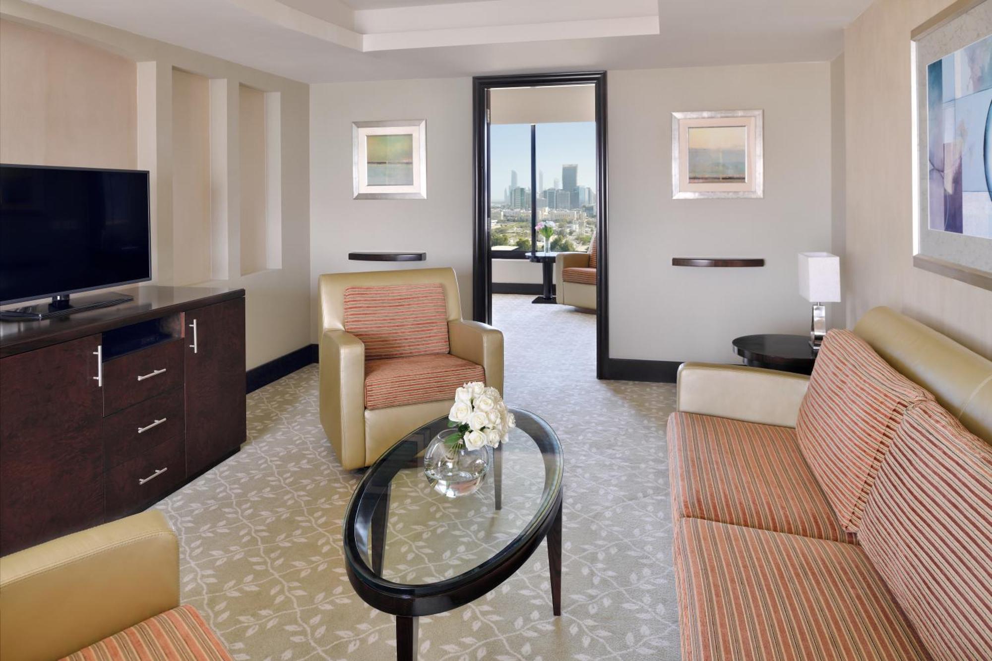 Отель Intercontinental Abu Dhabi By Ihg Экстерьер фото A living room in a suite at the Hilton San Francisco